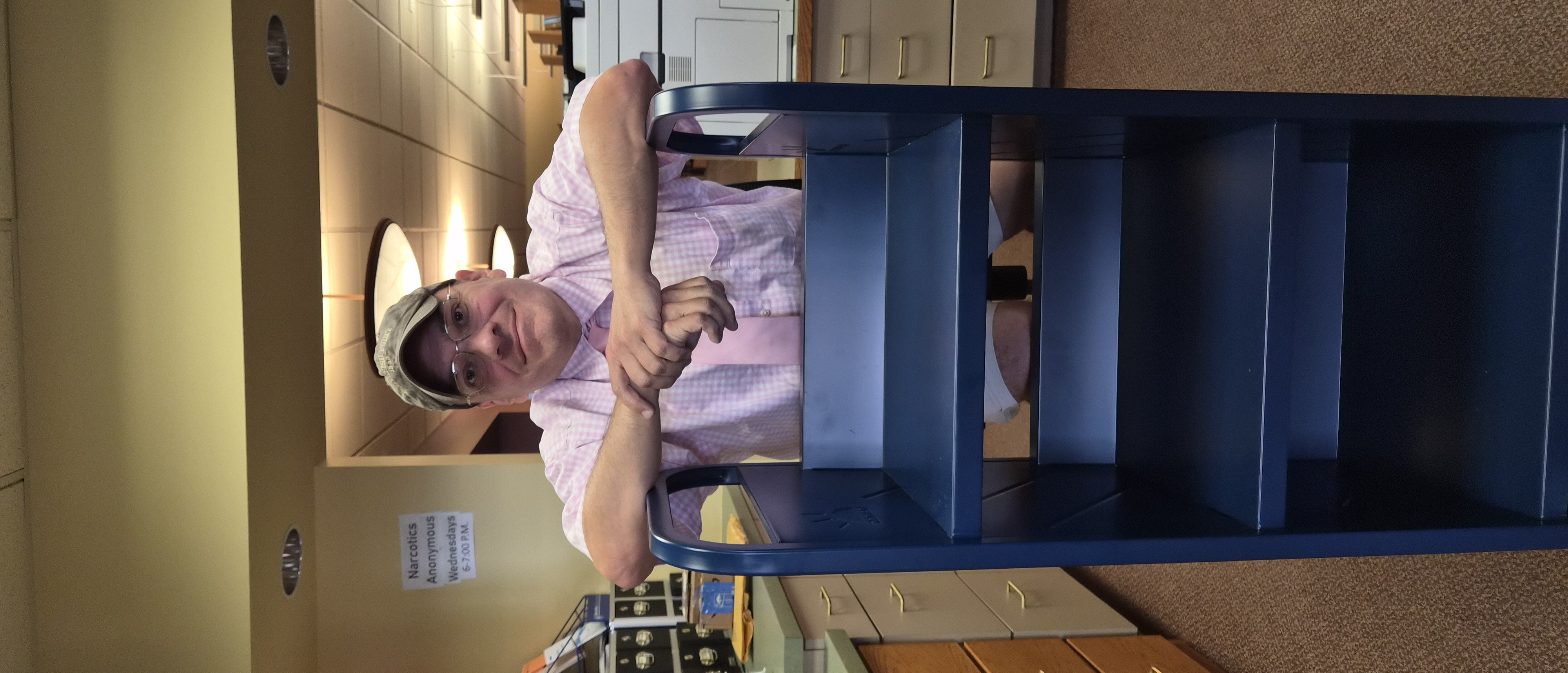 Erik posed with our newest and easy-moving book cart.